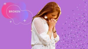 The reason why God breaks us 5 A lady on white clothing humbling herself while praying